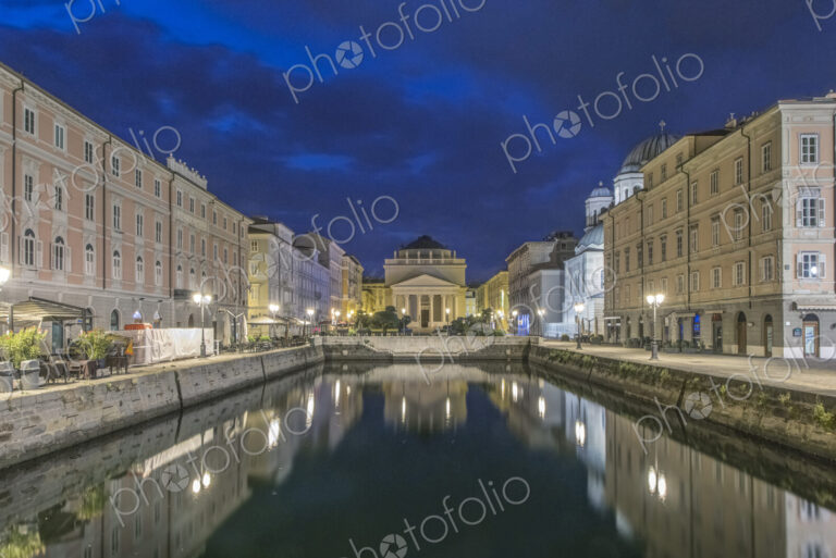 View of the Grand Canal lit up at night, Trieste, Italy.