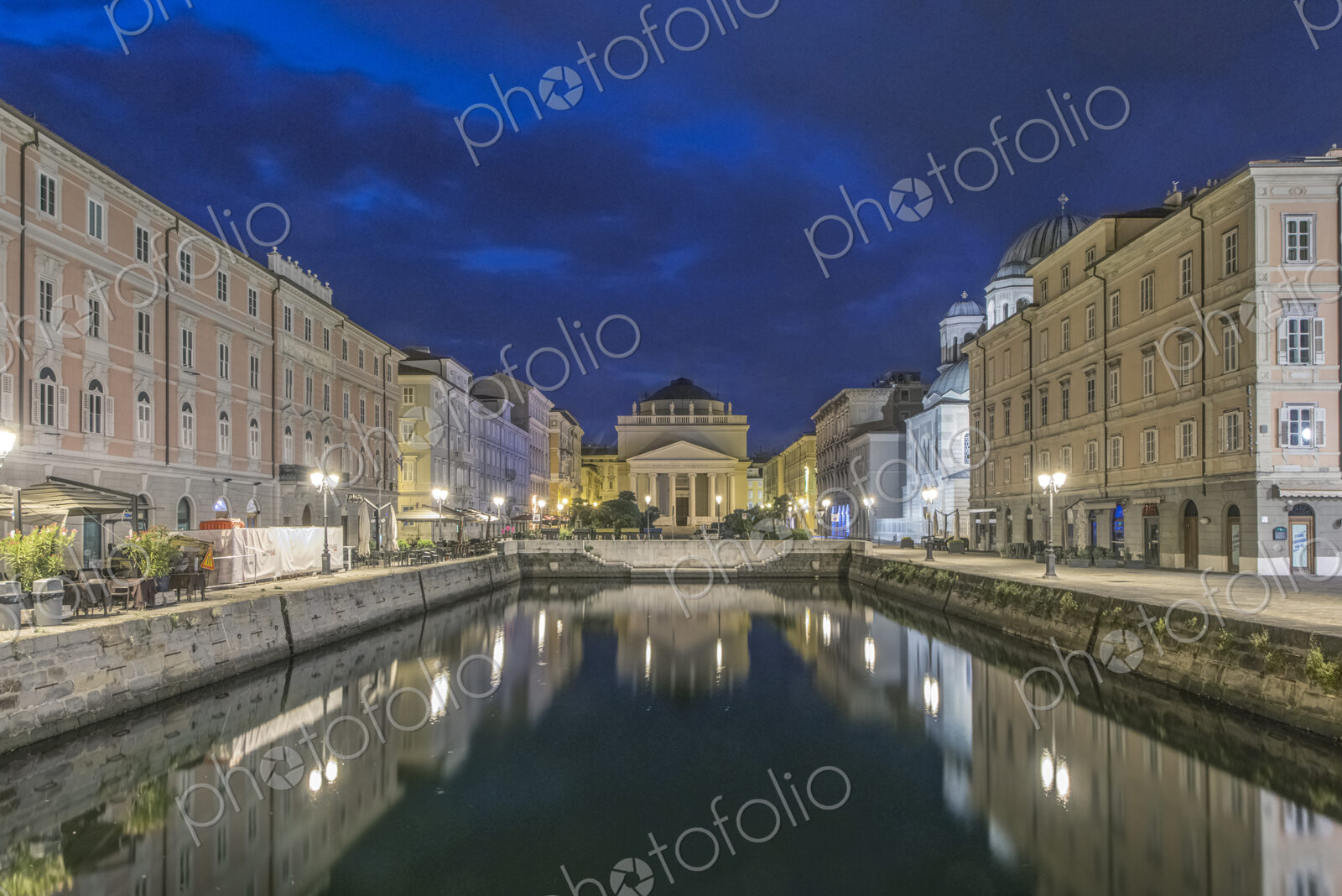 View of the Grand Canal lit up at night, Trieste, Italy.