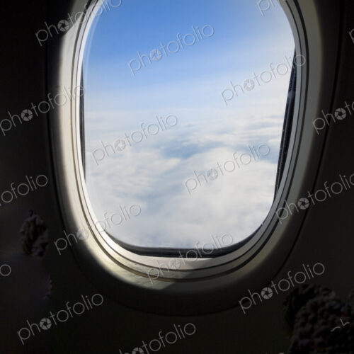 View of the clouds from an aircraft window. View of the clouds from an aircraft window.