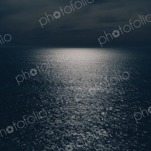 View out over the ocean at night, moonlight on the water, Oswald West State Park, Oregon View out over the ocean at night, moonlight on the water, Oswald West State Park, Oregon