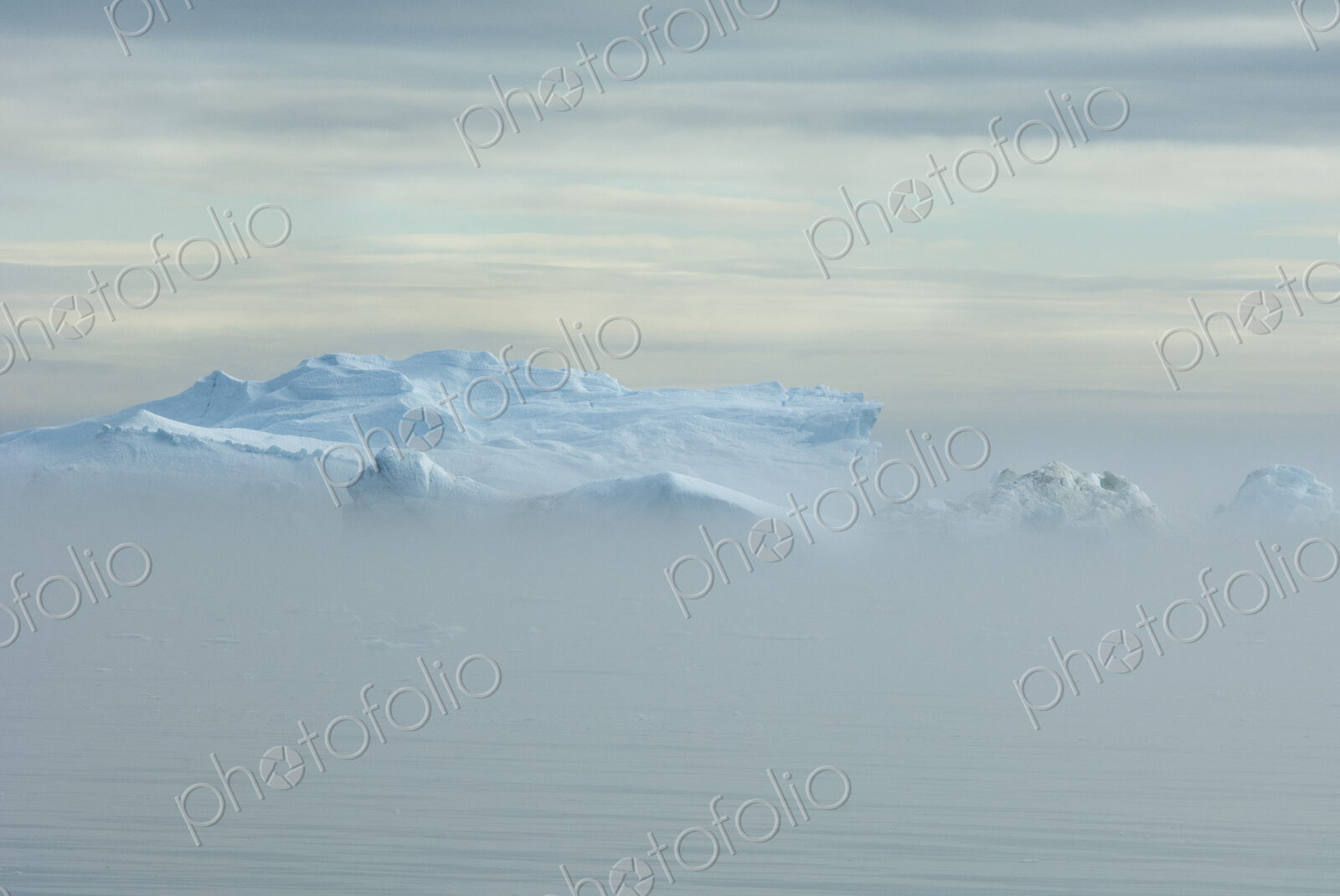 View over the iceberg and land mass off Baffin Bay in Greenland.