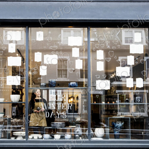 View through window into a pottery shop. View through window into a pottery shop.