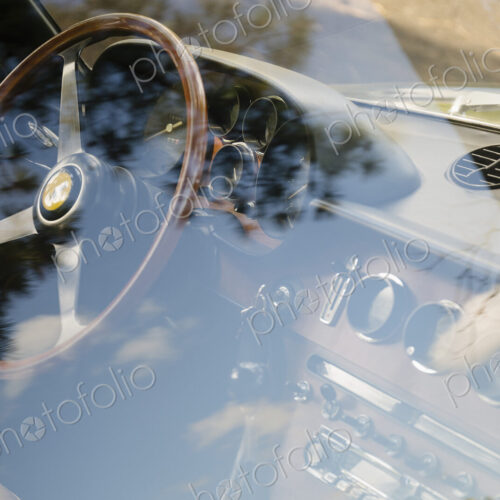 Vintage Ferrari dashboard viewed through window Vintage Ferrari dashboard viewed through window