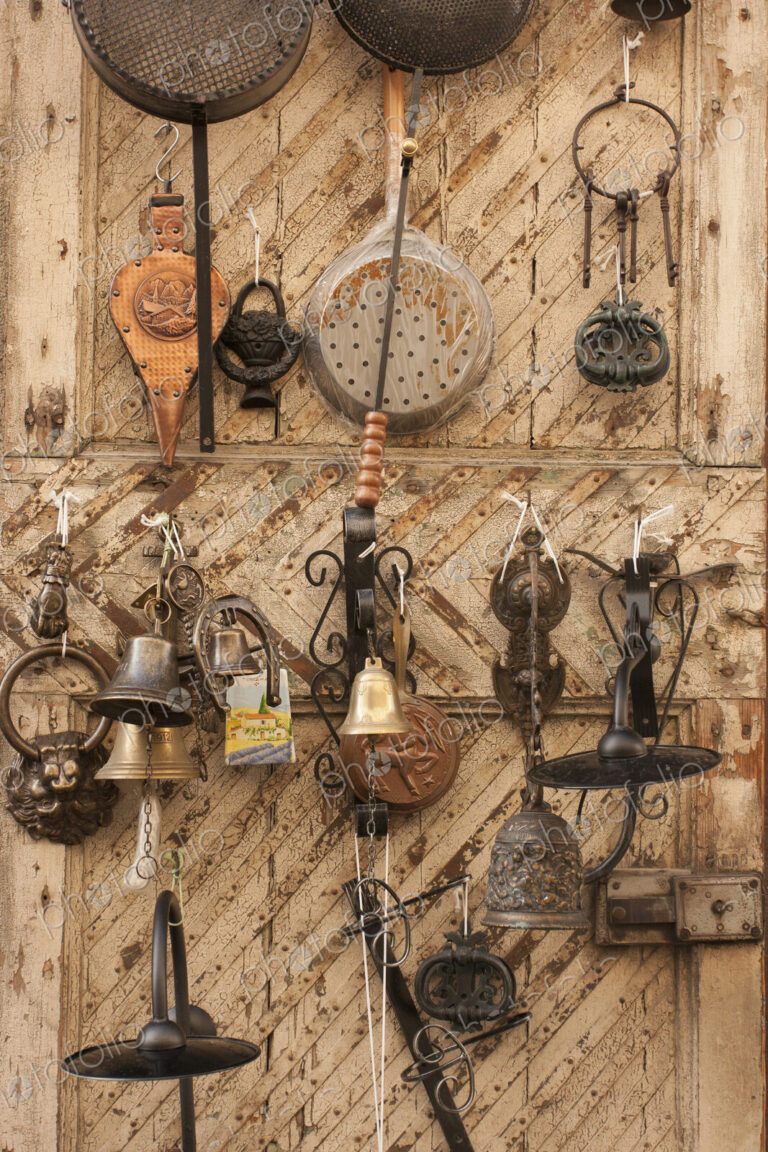 Vintage Tuscan metal household items displayed for sale.