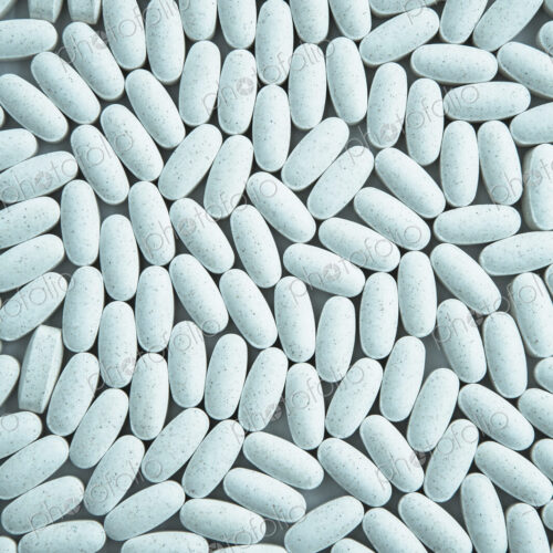 Vitamin C supplements, small blue oval tablets. Vitamin C supplements, small blue oval tablets.
