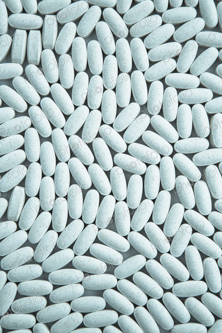 Vitamin C supplements, small blue oval tablets.