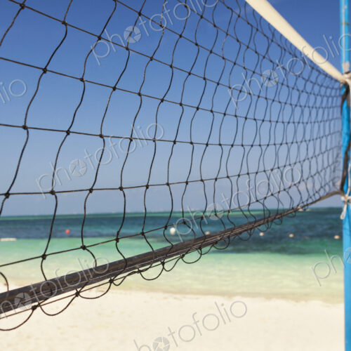 Volleyball net on a sandy beach Volleyball net on a sandy beach