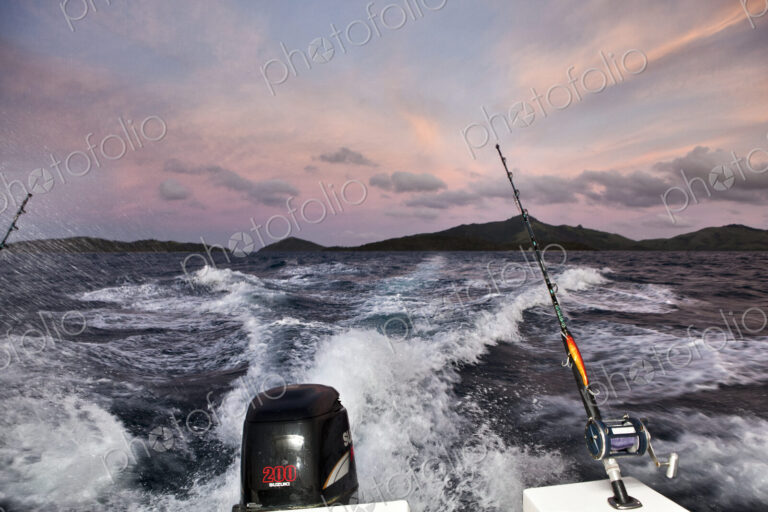 Wake From Fishing Boat At Sunrise