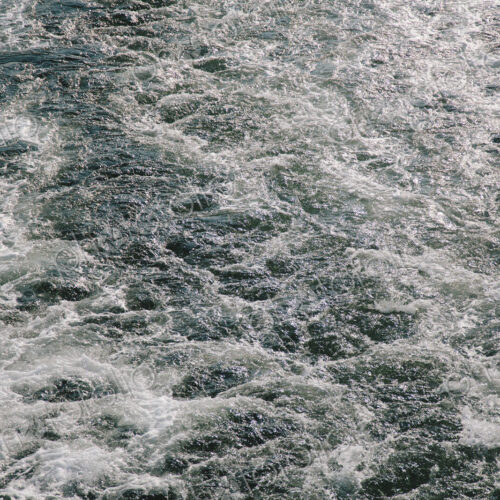 Wake from a passenger ferry on the water, near Seattle.