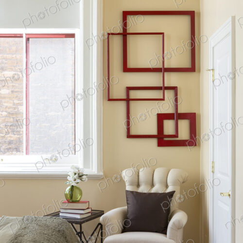 Wall art and armchair in corner of bedroom Wall art and armchair in corner of bedroom