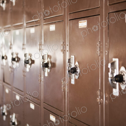Wall of high school lockers,in rows.