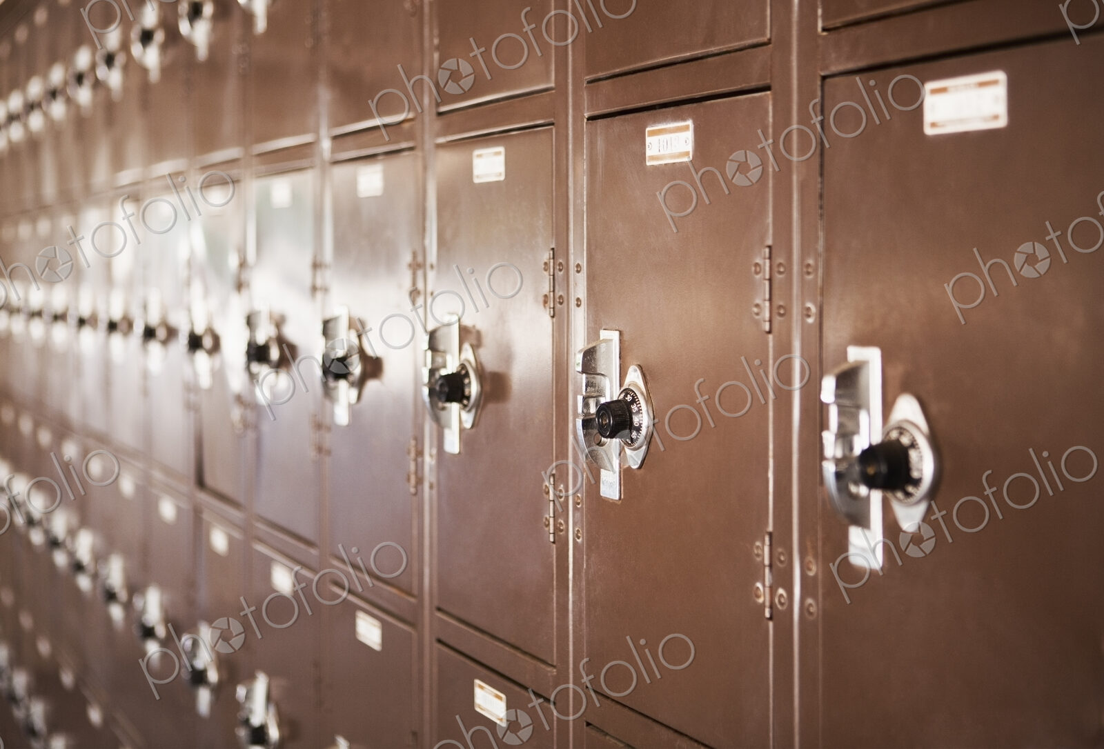 Wall of high school lockers,in rows.