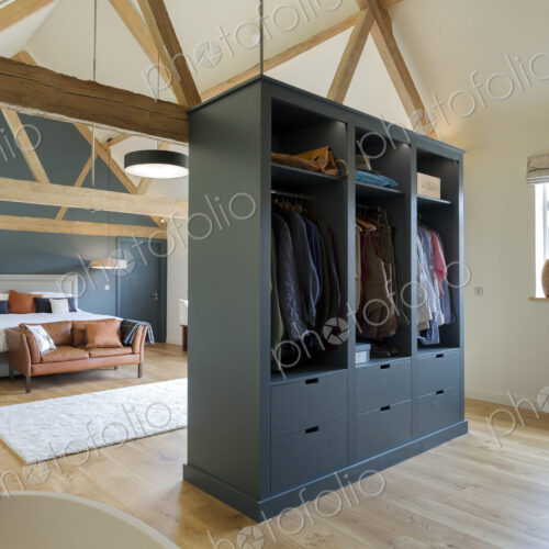 Wardrobe and bed in modern bedroom