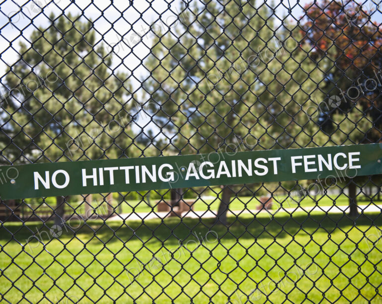 Warning Sign on Chain Fence