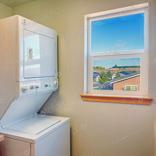 Washer and dryer with window in laundry room