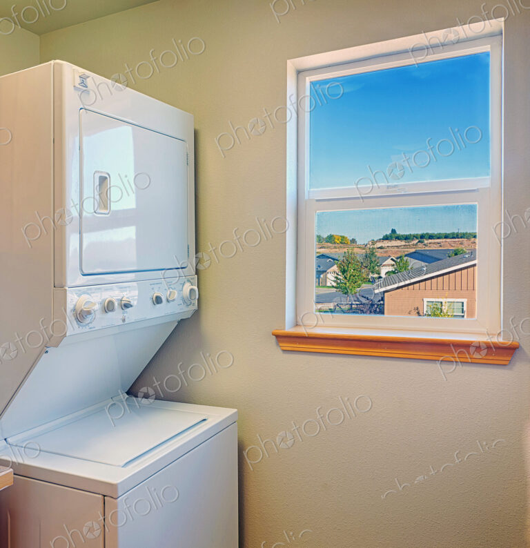 Washer and dryer with window in laundry room