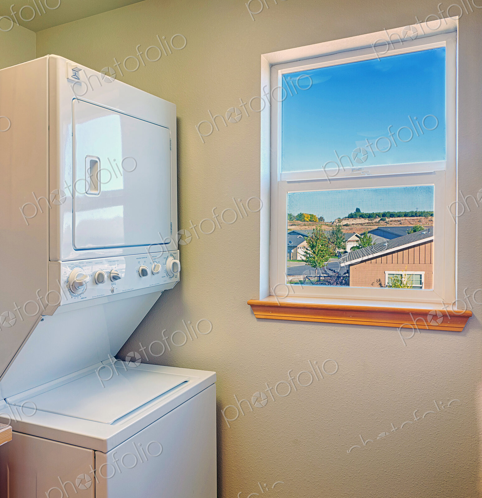 Washer and dryer with window in laundry room