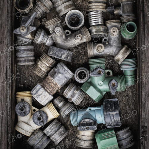 Washers and hose pipe joint fittings in a wooden box in the greenhouse. Washers and hose pipe joint fittings in a wooden box in the greenhouse.