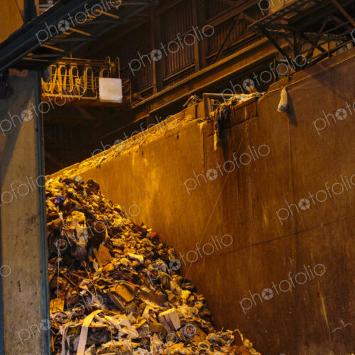 Waste to Energy Facility and Recycling Center, the interior, a bin of content for…