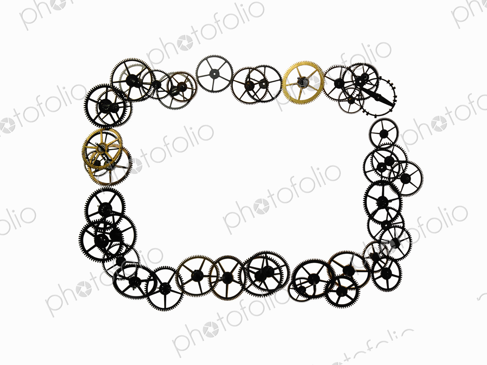 Watch gears, small precision made cog wheels arranged in a rectangular frame shape.…