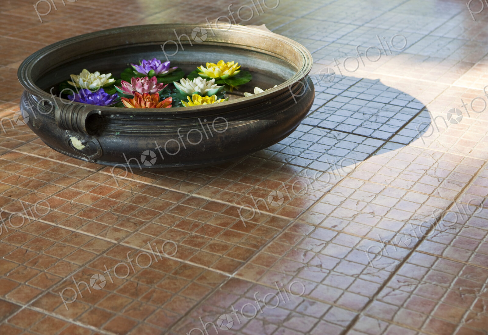 Water Bowl With Flowers on Tile Floor