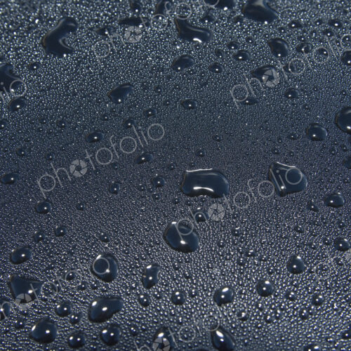 Water droplets on a car windscreen. Water droplets on a car windscreen.