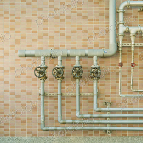 Water pipes on brick wall Water pipes on brick wall