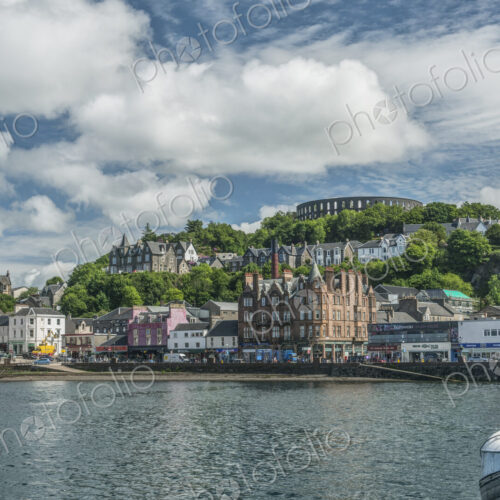 Waterfront town with Coliseum-style monument on hilltop, Mccaig's Tower and Battery. Waterfront town with Coliseum-style monument on hilltop, Mccaig's Tower and Battery.