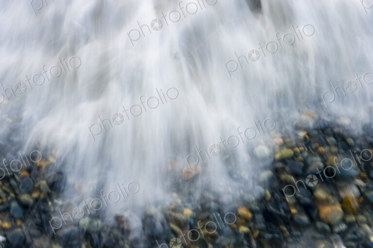 Wave flowing over beach gravel, Salt Creek Recreational Area, Port Angeles