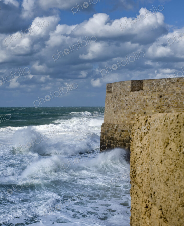 Waves Breaking Against Ancient Walls