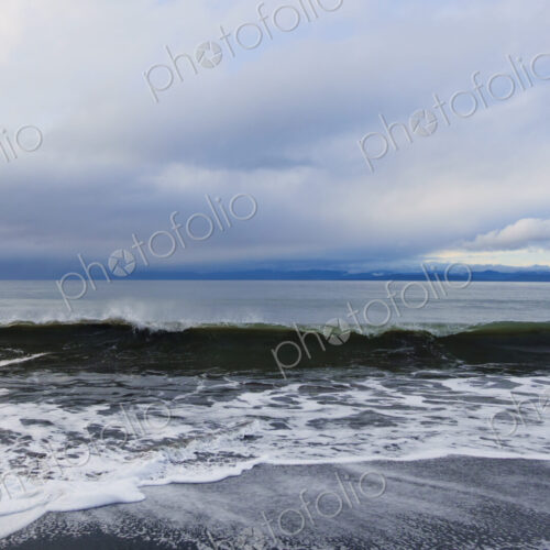 Waves breaking on beach along the Strait of Juan de Fuca, Port Angeles, WA USA