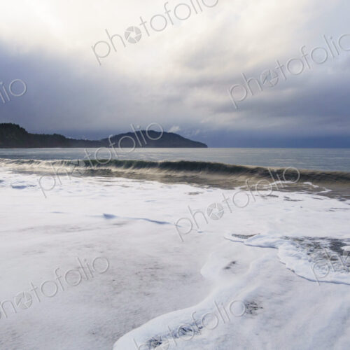 Waves breaking on beach along the Strait of Juan de Fuca, Port Angeles, WA USA
