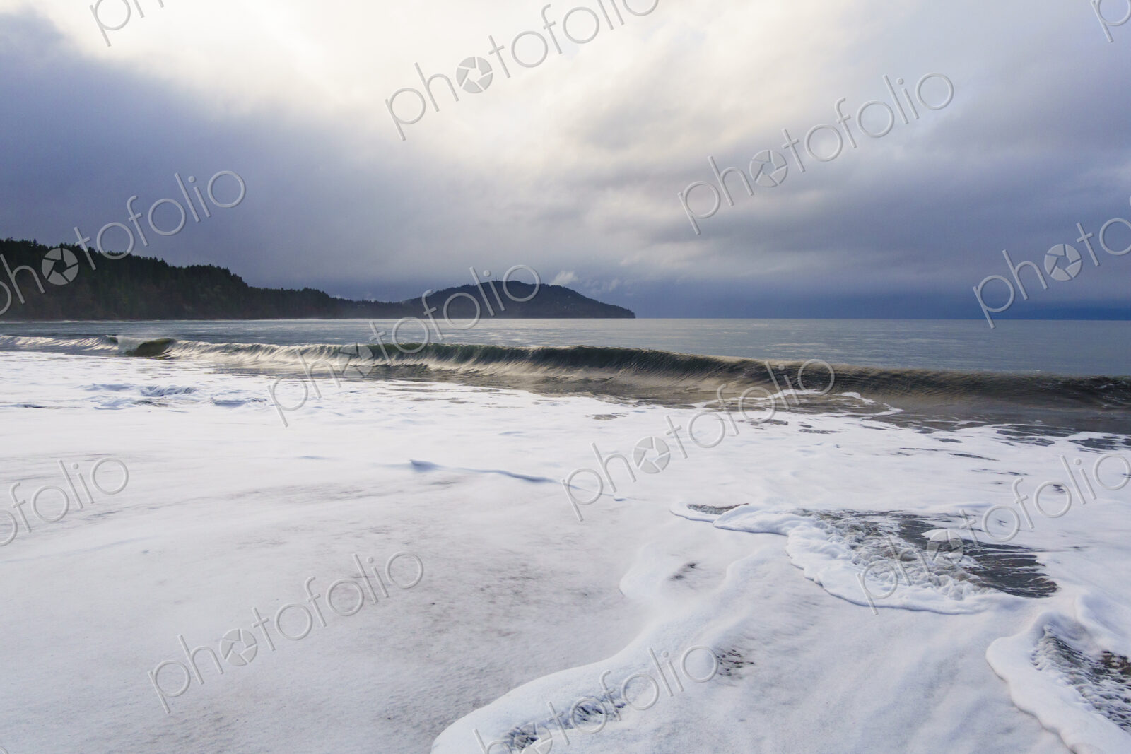 Waves breaking on beach along the Strait of Juan de Fuca, Port Angeles, WA USA