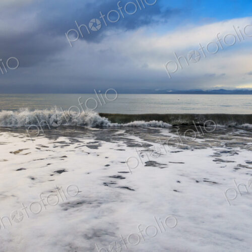 Waves breaking on beach along the Strait of Juan de Fuca, Port Angeles, WA USA