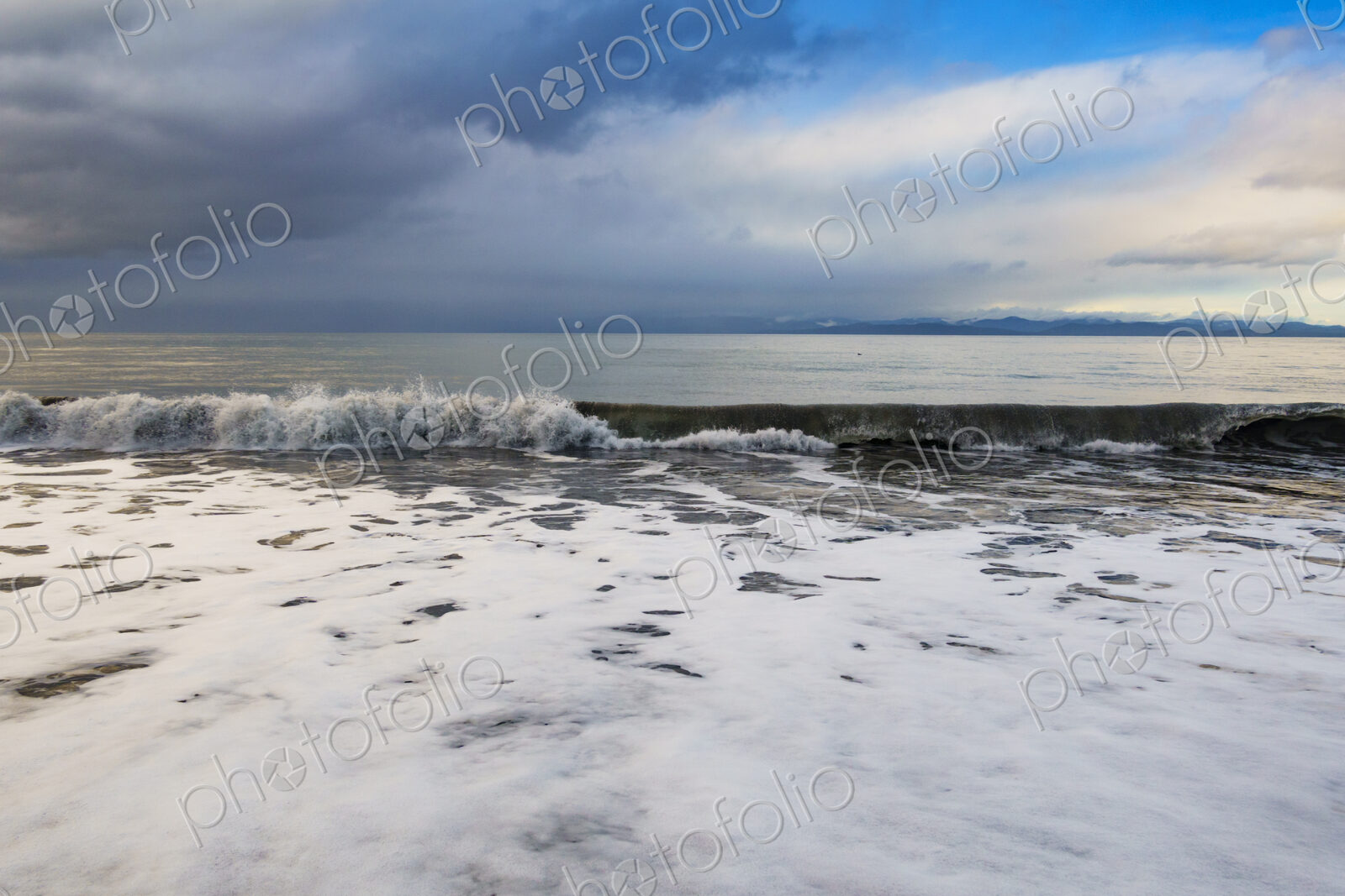 Waves breaking on beach along the Strait of Juan de Fuca, Port Angeles, WA USA