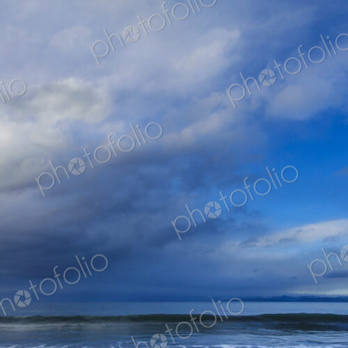 Waves breaking on beach along the Strait of Juan de Fuca, Port Angeles, WA USA