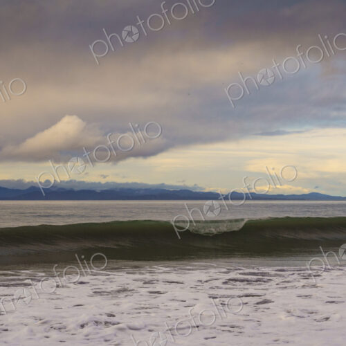 Waves breaking on beach along the Strait of Juan de Fuca, Port Angeles, WA USA