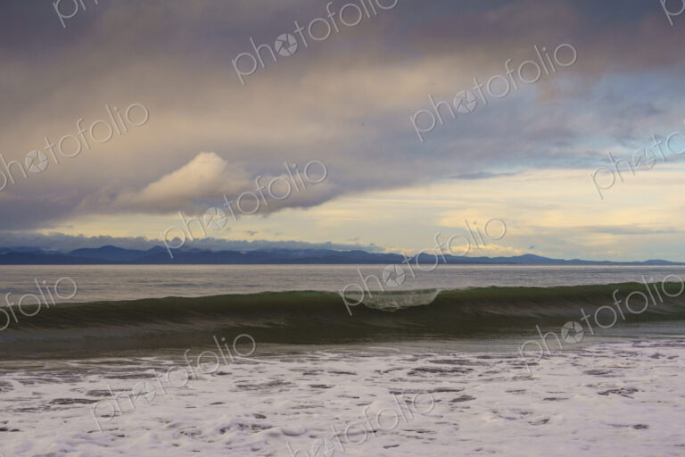 Waves breaking on beach along the Strait of Juan de Fuca, Port Angeles, WA USA