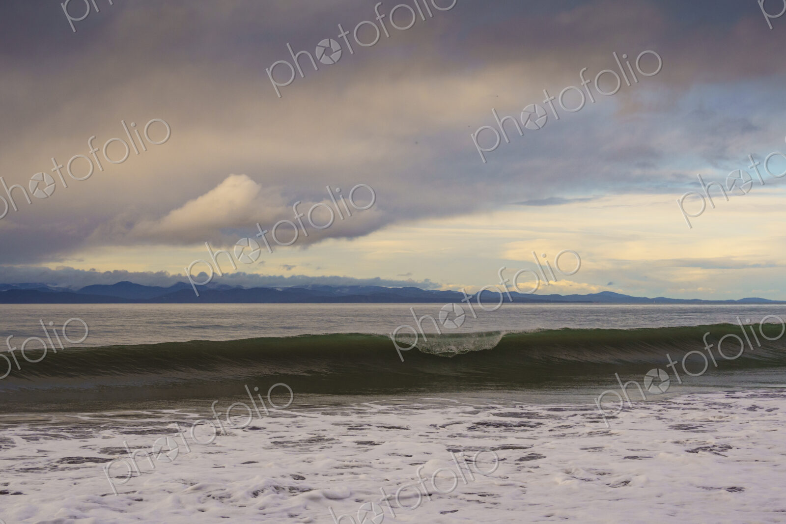 Waves breaking on beach along the Strait of Juan de Fuca, Port Angeles, WA USA