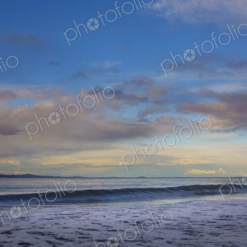 Waves breaking on beach along the Strait of Juan de Fuca, Port Angeles, WA USA