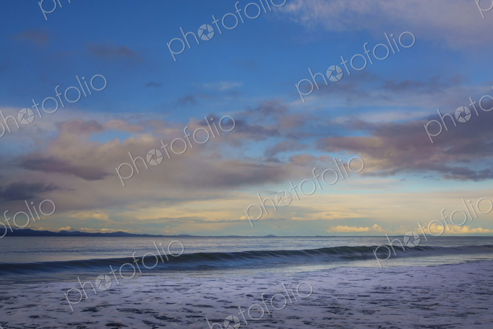 Waves breaking on beach along the Strait of Juan de Fuca, Port Angeles, WA USA
