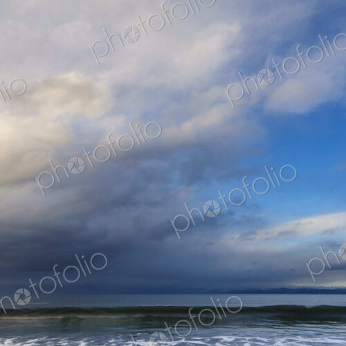 Waves breaking on beach along the Strait of Juan de Fuca, Port Angeles, WA USA