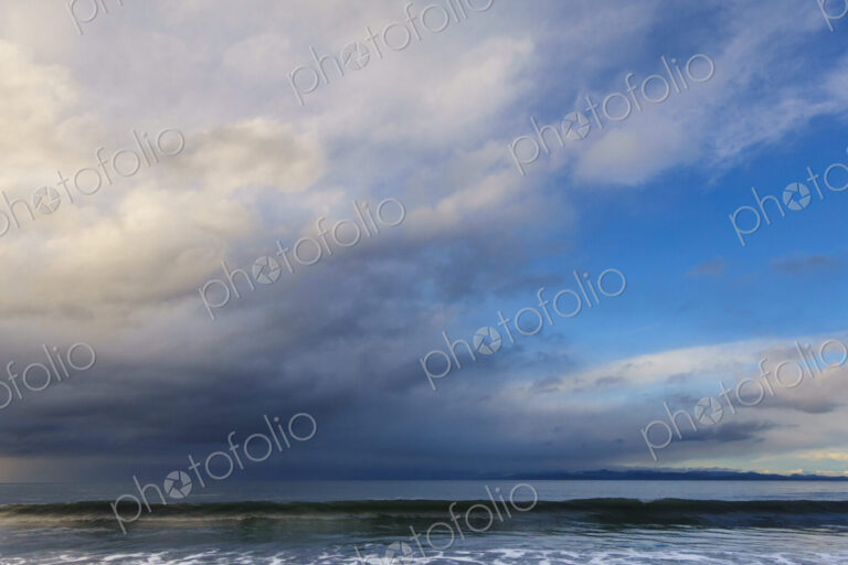 Waves breaking on beach along the Strait of Juan de Fuca, Port Angeles, WA USA