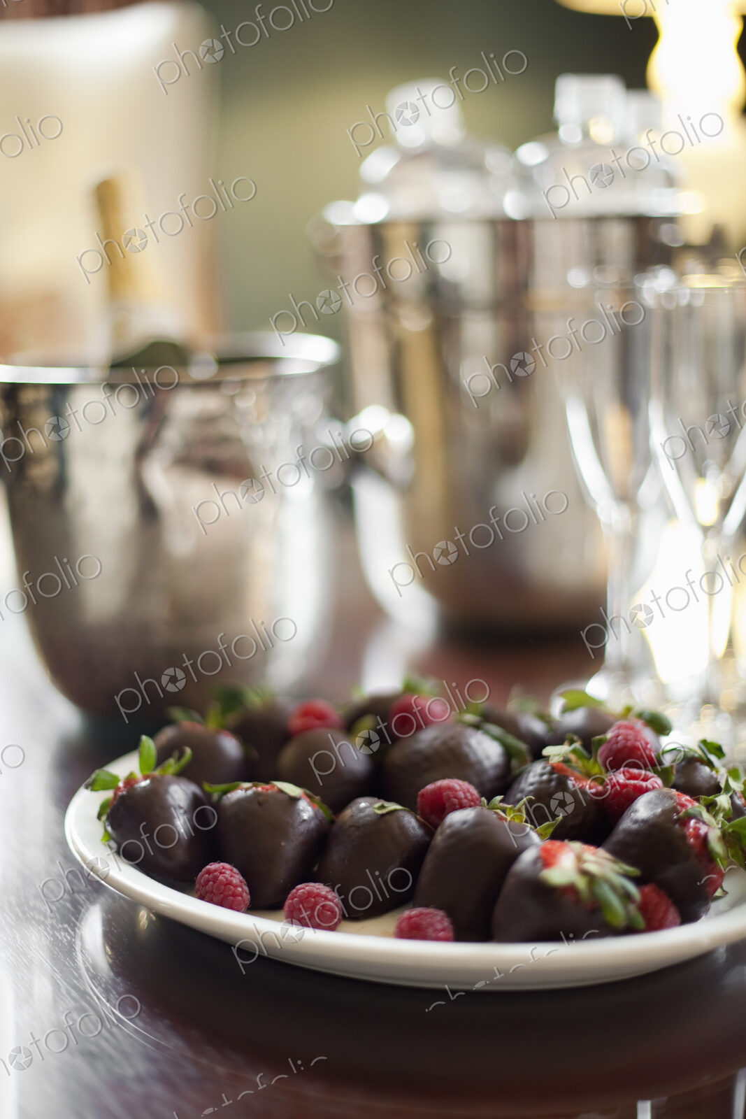 Wedding dessert. Plate of hand-dipped organic strawberries, fruit in artisinal…