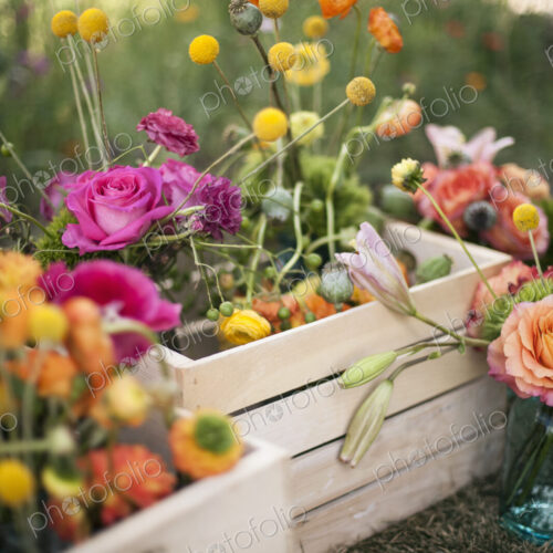 Wedding table decorations. A wooden box of fresh flowers, delicate and brightly… Wedding table decorations. A wooden box of fresh flowers, delicate and brightly…