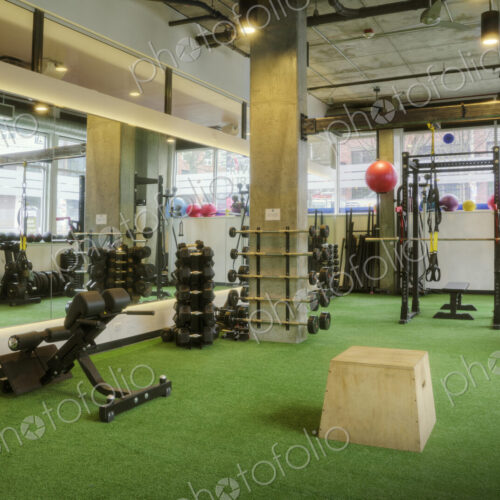 Weights room in an empty gym.