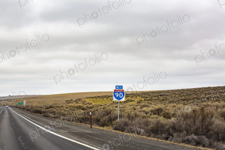 West I-90 road sign in high desert, Rye Grass Summit, nterstate 90