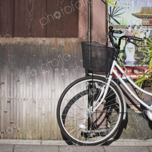 White Bicycle Parked on a Sidewalk White Bicycle Parked on a Sidewalk