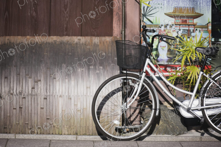 White Bicycle Parked on a Sidewalk