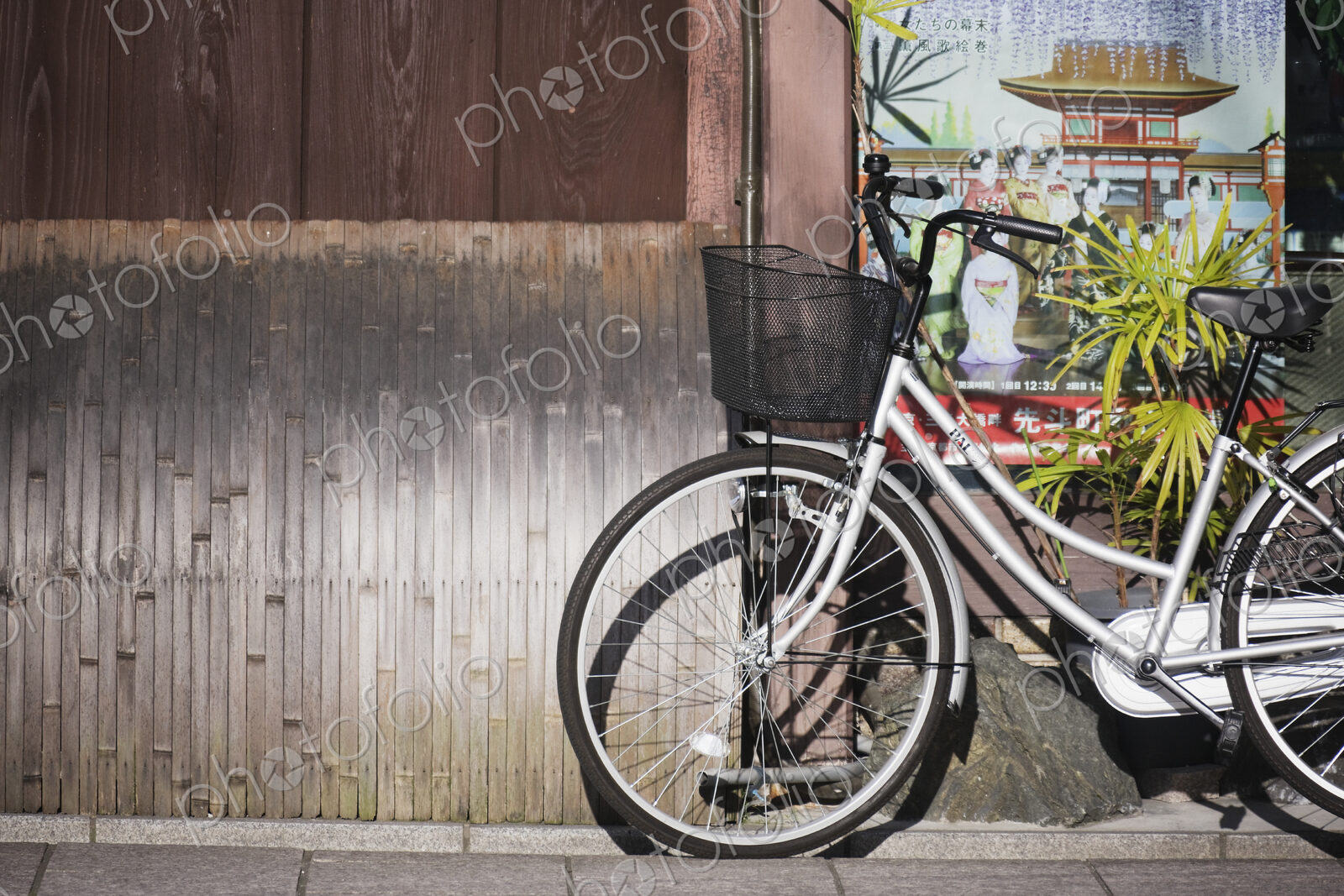 White Bicycle Parked on a Sidewalk